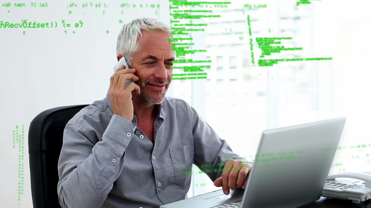 Animation of data processing over caucasian businessman using laptop