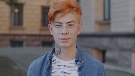 young man with ginger hair and glasses