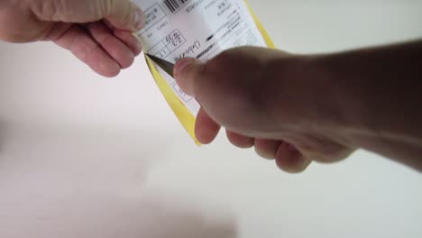 man unpacking parcel package from abroad. close-up view