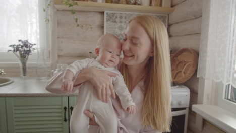 mother and baby in kitchen