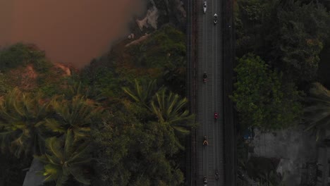 Top-down-view-of-bridge-over-mekong-river-at-Luang-prabang-Laos,-aerial