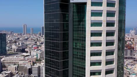modern skyscraper in an urban cityscape with a view of the sea
