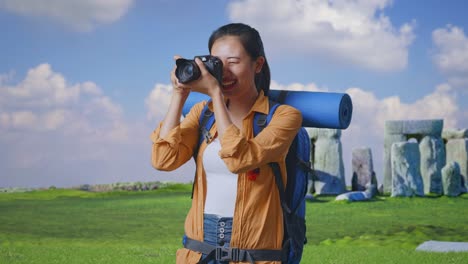 woman taking photos at stonehenge