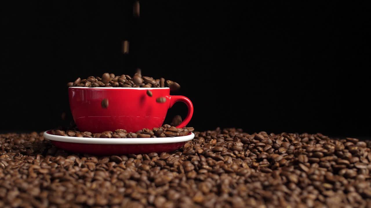 Coffee Beans Pouring Into Red Cup, Slow Motion