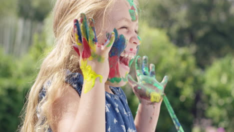 cute preschooler learning how to paint little girls painting on face