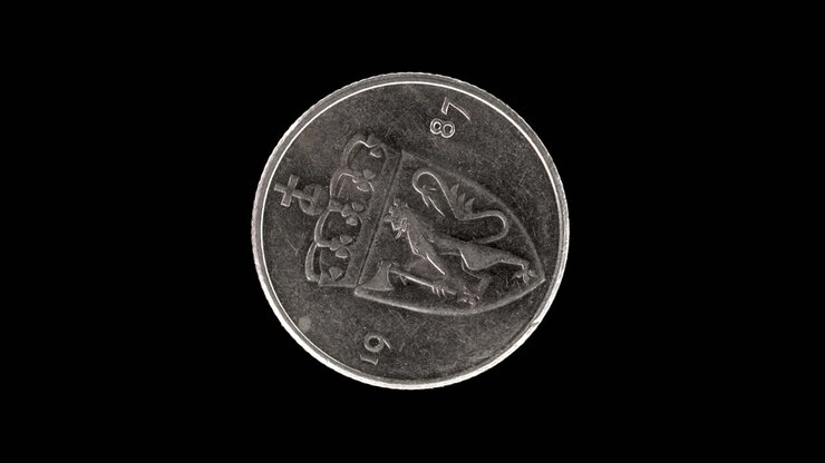 Norway 1987 50 øre coin obverse with crowned shield bearing Norwegian lion rotating on black background