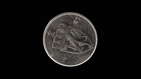 norway 1987 50 øre coin obverse with crowned shield bearing norwegian lion rotating on black background
