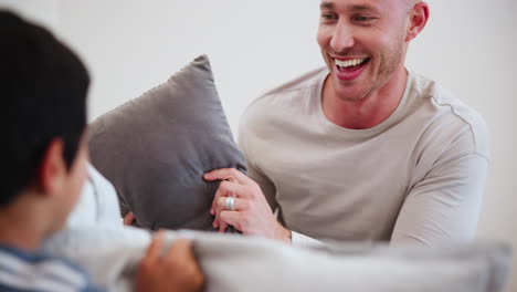 happy, pillow fight and father with child on bed