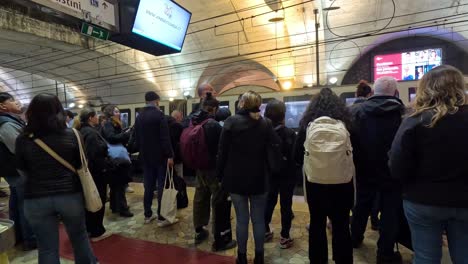 people gathered at a metro station platform