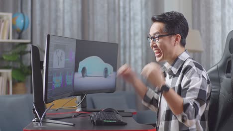 side view of asian male automotive designer screams goal for success celebration while working on 3d model of ev car on the desktop computers in the studio