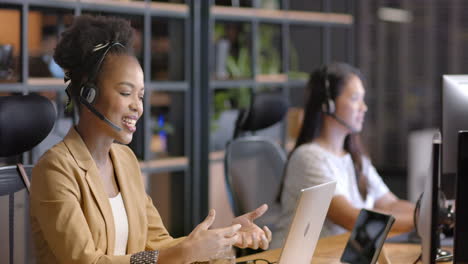 Young-African-American-woman-works-at-her-desk-in-a-business-office