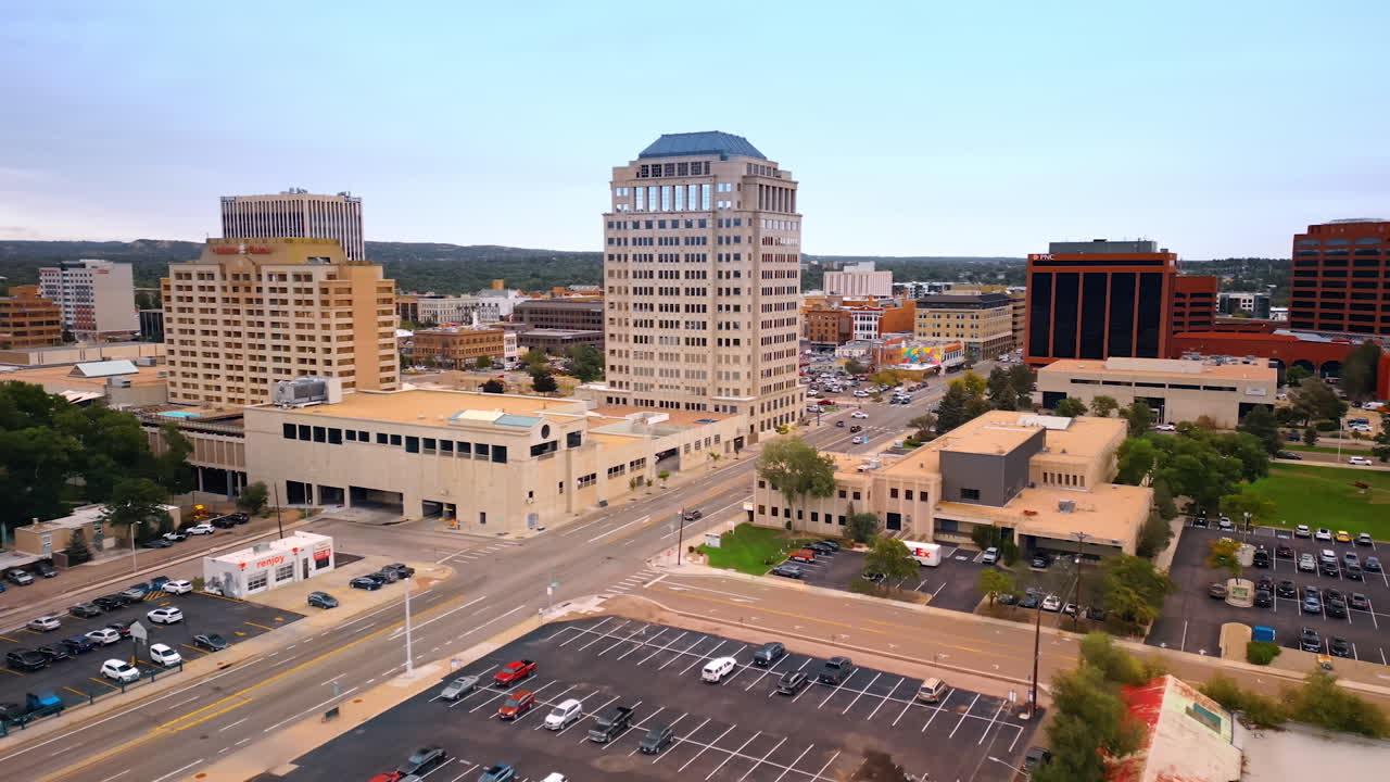 Colorado Springs, USA, 22 July 2025: Flying over the cityscape of Colorado Springs, Colorado, USA. View on the multiple parking lots in the city scenery