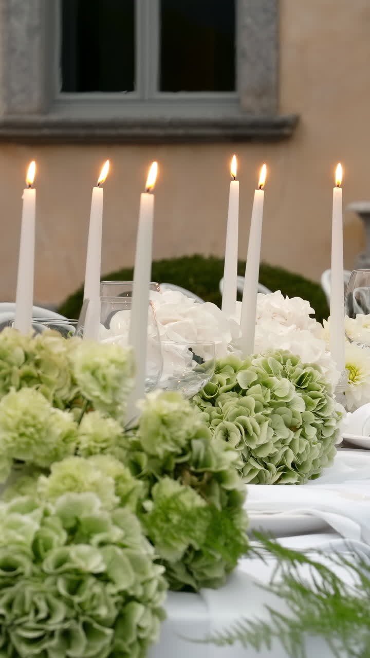 Elegant Table Setting with Candles and Flowers