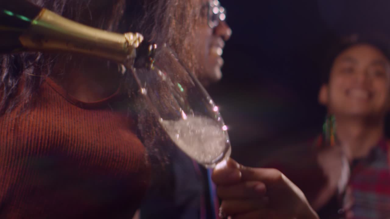 CU Woman Pours Champagne at Party