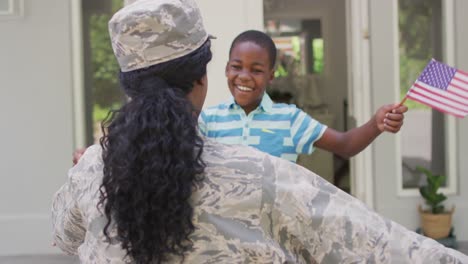 animation of happy african american soldier mother and son hugging and embracing