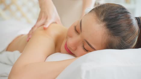 woman receiving a relaxing back massage