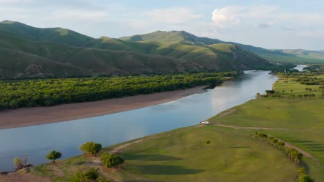 Aerial-View-Of-River,-Forest,-Grassland-And-Mountain-Range-In-Hulun-Buir,-Inner-Mongolia,-China