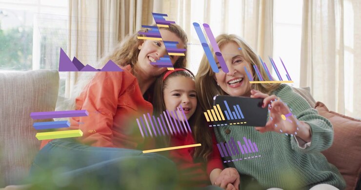 Grandma holding phone and initiating technology charts guiding mother and daughter into selfie