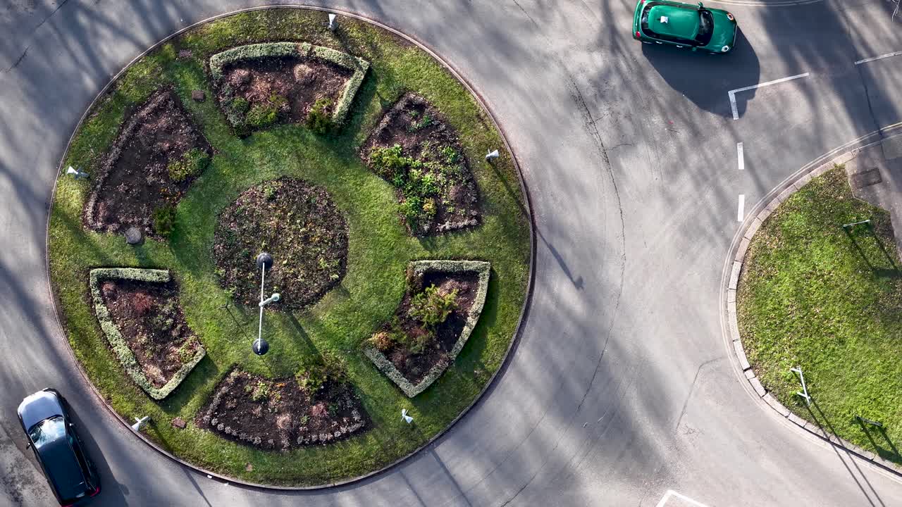 Sollershott circus aerial view rising above vehicles driving around the first UK traffic roundabout