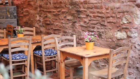 outdoor cafe with wooden tables and chairs