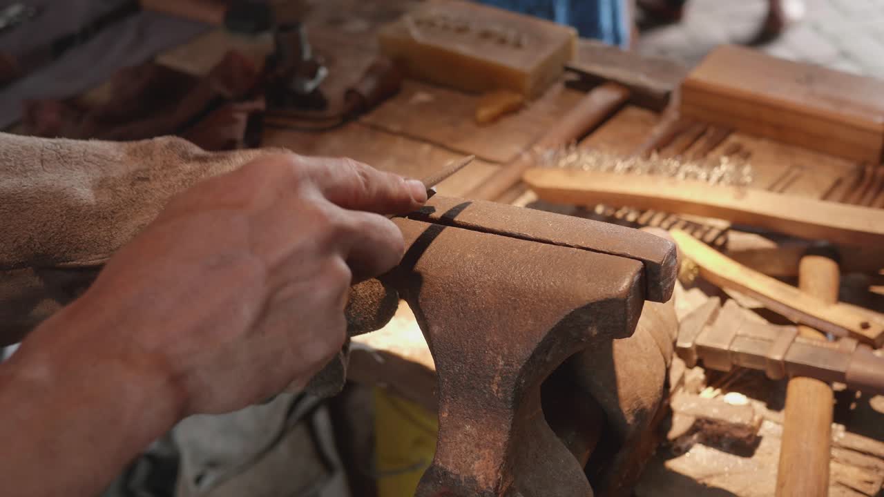 Blacksmith at renaissance fair forges metal on anvil, Philadelphia Renaissance Fair, Fort Mifflin, Pennsylvania