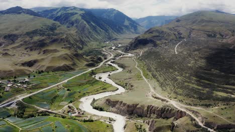 mountain valley with river and farmland