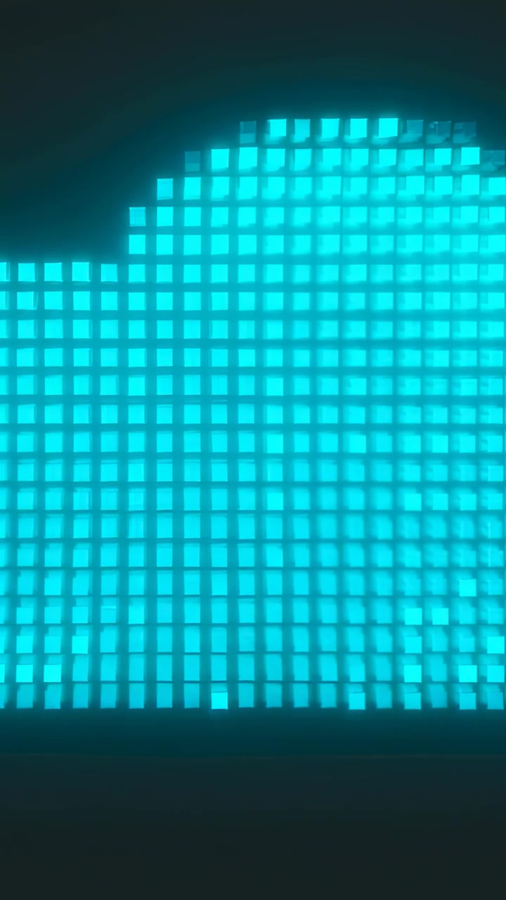 Vertical video: First frame starting, cyan LED grid forming dome, making wave on dark stage base