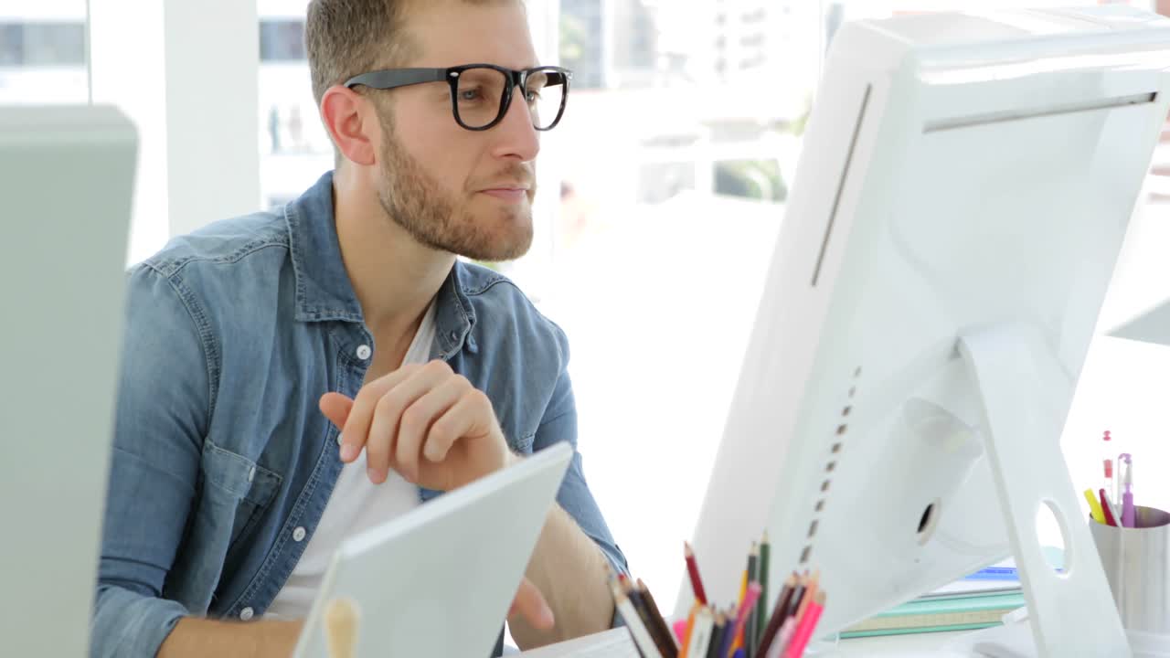 Young businessman working concentrated at his desk