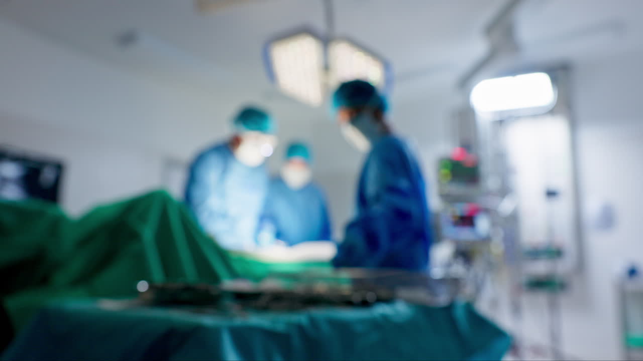 Læger, akut og operation på en operationsstue