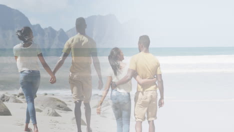 compuesto de una feliz pareja afroamericana abrazándose y caminando de la mano en la playa.