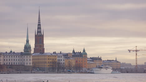 riddarholmen church and buildings against golden hour sky, gamla stan