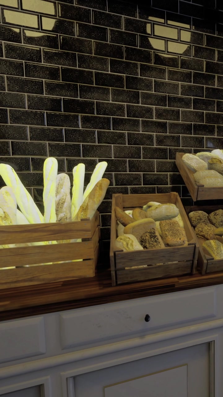 Fresh bread displayed in wooden crates at a bakery during daytime