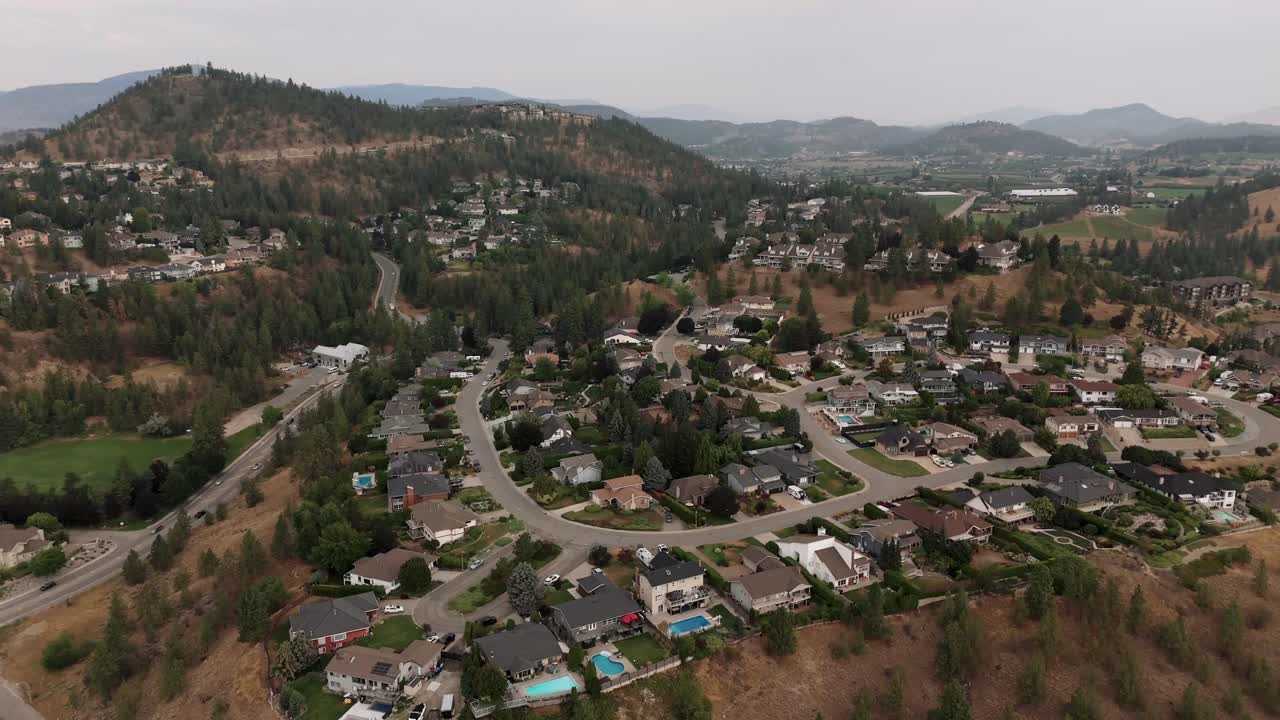 Enjoy stunning aerial views of Kelowna, BC in summer, featuring crystal-clear lakes, scenic mountains, and vibrant landscapes captured by drone in 4K.