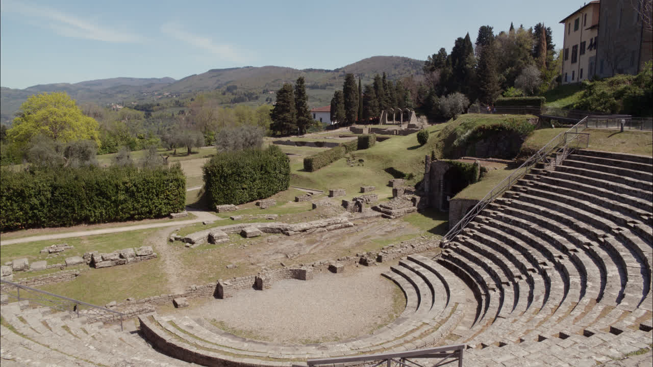 Ancient Roman Amphitheater Ruins in Fiesole, Italy on a Sunny Day