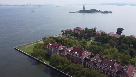 ellis island with statue of liberty in the background