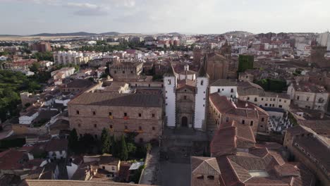 Iglesia-de-San-Francisco-Javier-aerial-view-circling-above-the-iconic-heritage-catholic-church-in-the-city-of-Cáceres,-Spain