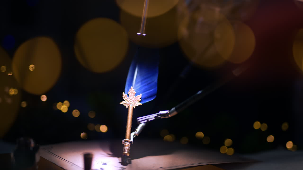 Highlighted spot where the robotic arms hold a writing pen. Demonstration of high precise work of Da Vinci equipment. Lights at dark blurred backdrop.