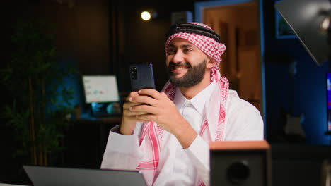 man sending texts working at home