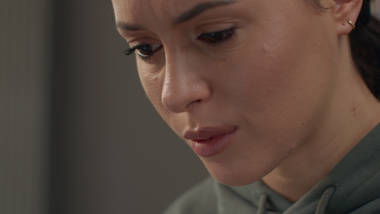 Close Up Of Anxious Woman Sitting Indoors On Sofa Working From Home Using Laptop Worried About Cost Of Living Crisis 6