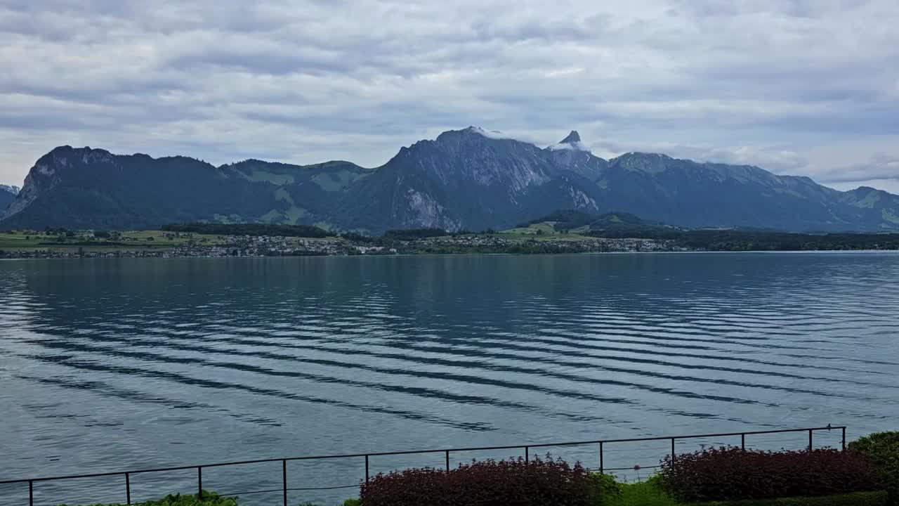 Static shot of Swiss alps from lake Thun