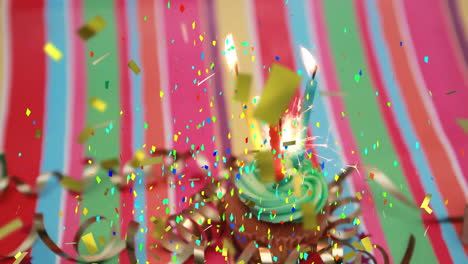 animation of multi coloured confetti falling over cupcake with candle