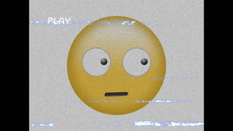 animación digital del efecto de falla de vhs sobre un emoji de cara confundido contra un fondo negro