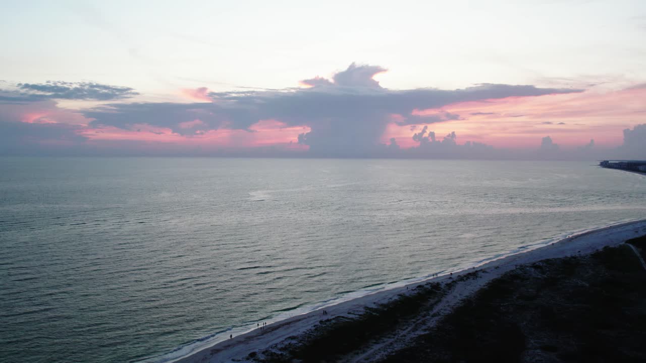 Beautiful Florida sunset in Sarasota. Rising shot over sand dunes. 60 fps