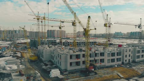 building district construction site with yellow cranes