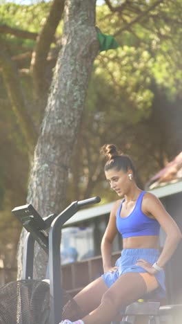 woman exercising on air bike