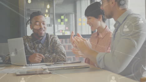 animation of network of connections with people icons over diverse businesspeople in office