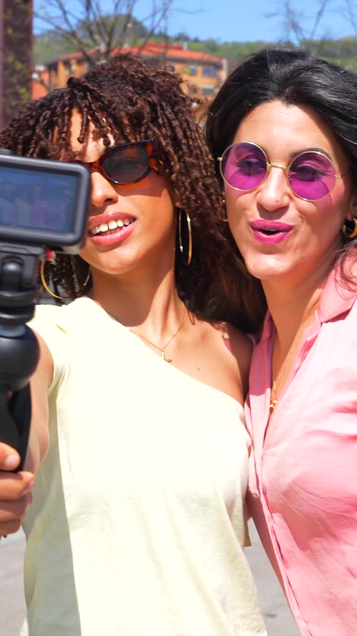 Three Women Taking Pictures Outdoors