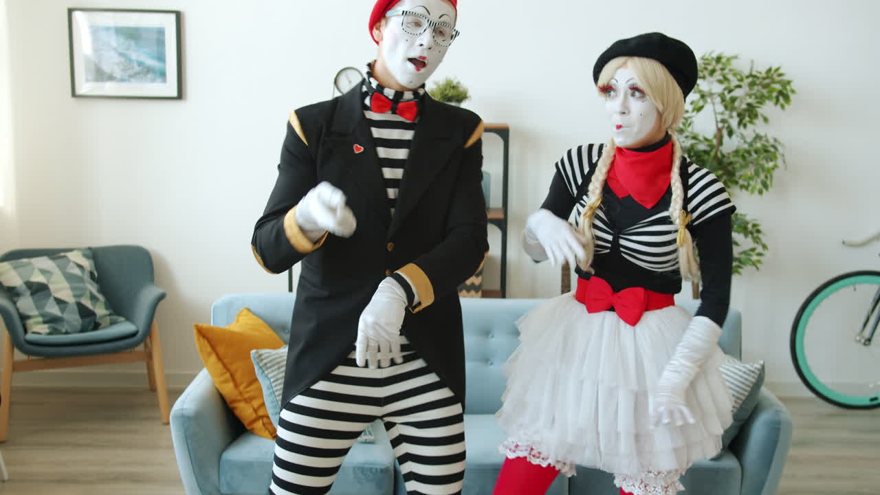 Mime Artists Dancing in Living Room