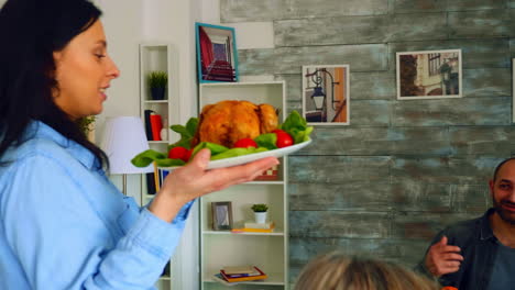 follow shot of young woman with roasted chicken