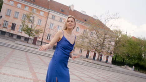 beautiful woman dancing alone in a public square 3